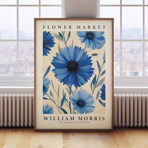 Vintage floral wall art featuring blue cornflowers and green leaves
