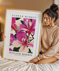 William Morris botanical art print with pink petals and green leaves
