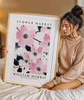 Pink floral poster with dark-centred blossoms
