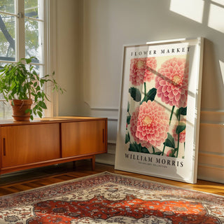 Botanical pink wall decor featuring blooming dahlias and green leaves