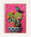 Jewel-toned hummingbird perched on corazon de nopal art print for living room