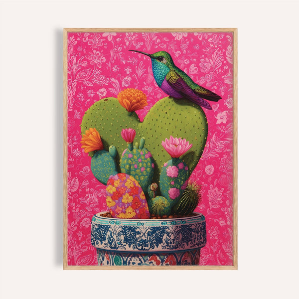 Jewel-toned hummingbird perched on corazon de nopal art print for living room