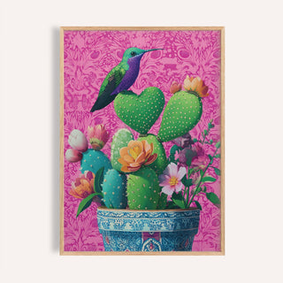 Framed Heart Shaped Cactus artwork featuring a hummingbird and colourful cacti with flowers against a pink background