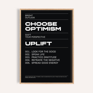 Framed affirmation print with Choose Optimism text in white on black background