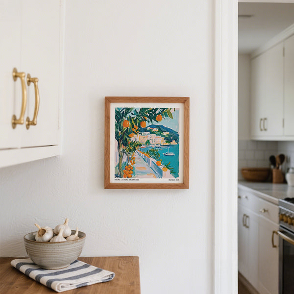 View of boats and pastel buildings framed by oranges in our Art Prints of Italy.