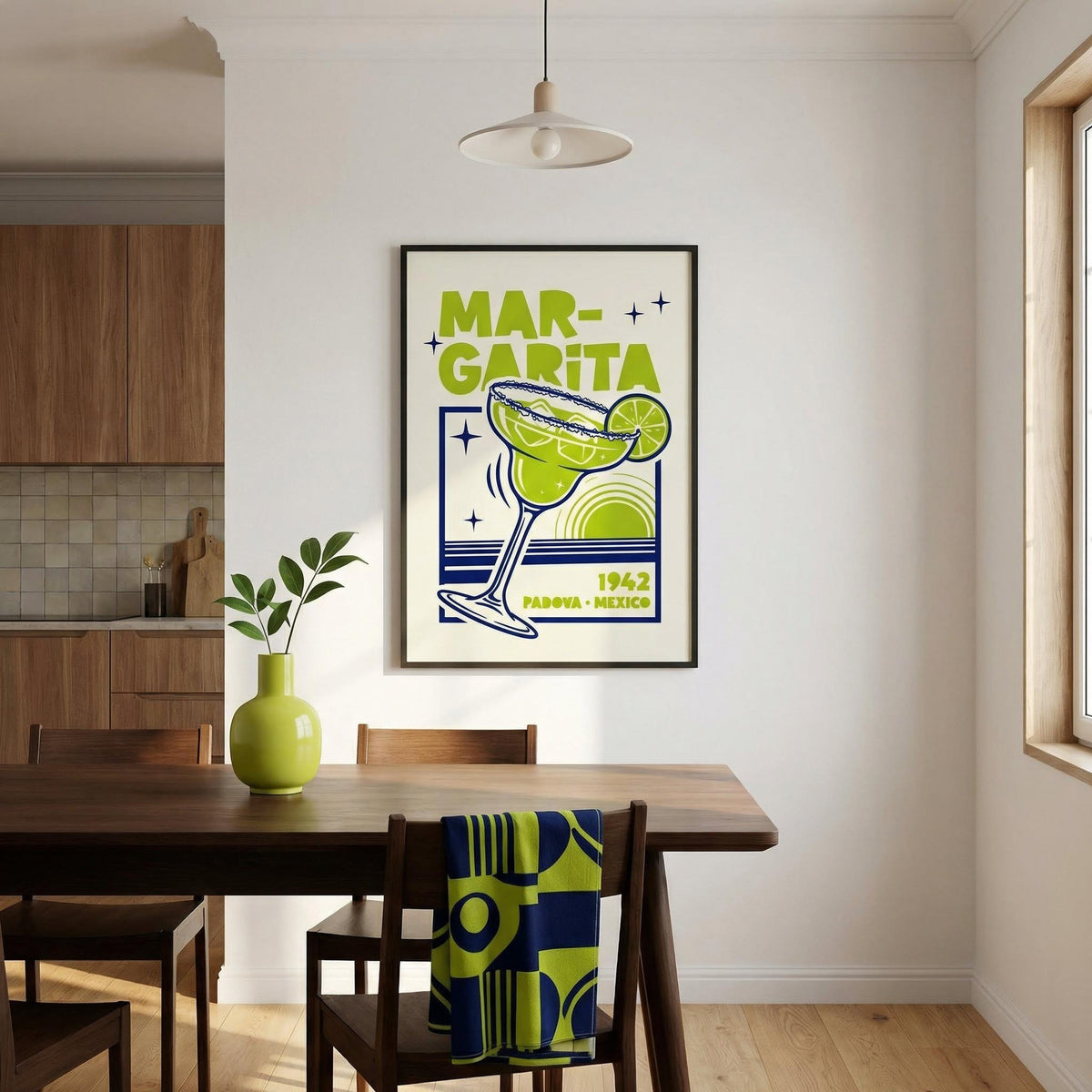 Dining room with a 'Margarita' themed poster on the wall, a table, and chairs.