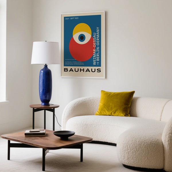 Bauhaus poster art in bold colors above a sofa