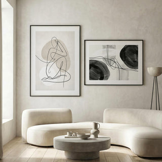 Minimalist abstract wall art set of 2 featuring flowing black and beige forms.
