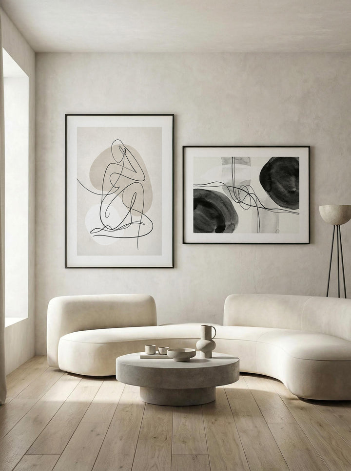 Minimalist abstract wall art set of 2 featuring flowing black and beige forms.