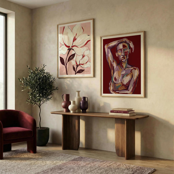 Living room with abstract art on the wall, a console table, and a chair.
