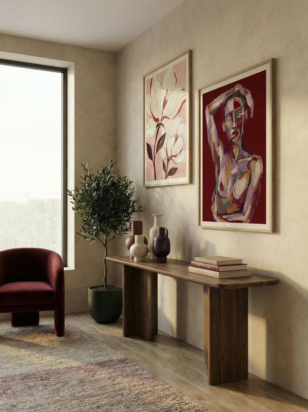 Modern living room with a console table, armchair, and wall art.