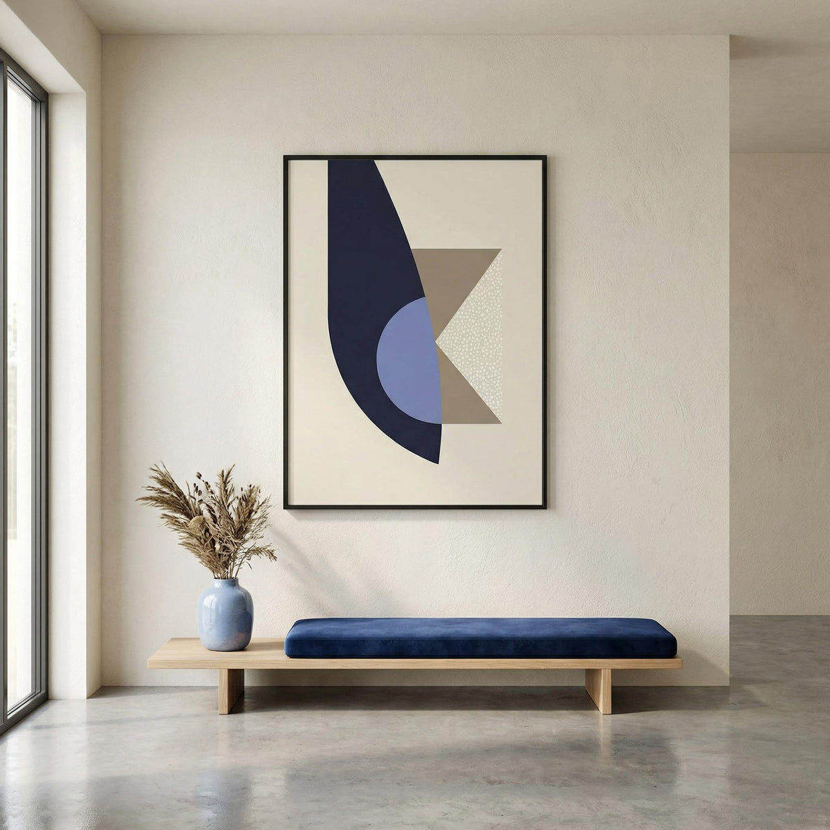 Modern interior with a abstract art piece on the wall, a blue bench, and a vase with dried plants.