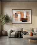 Modern living room with a gray sofa, abstract painting, and decorative items.