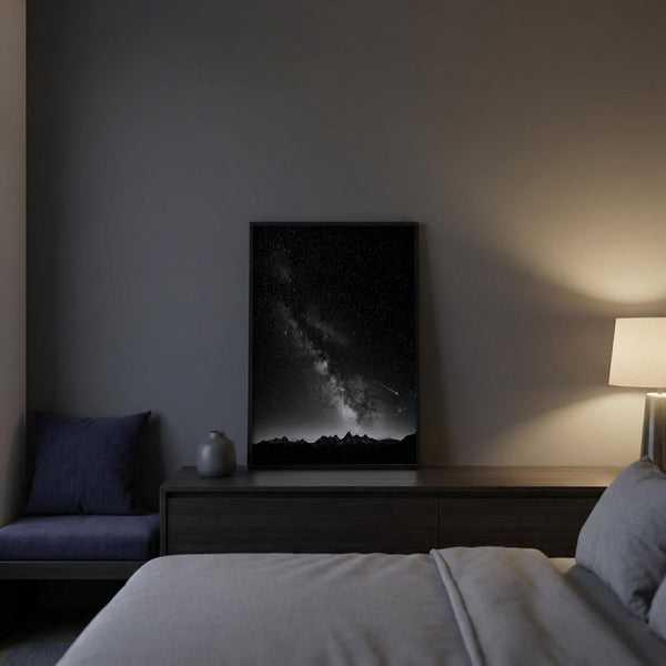 Modern bedroom with dark walls, a bed, and a framed artwork on the wall.