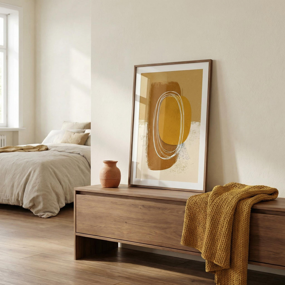 Modern bedroom with abstract art on the wall and wooden bench.