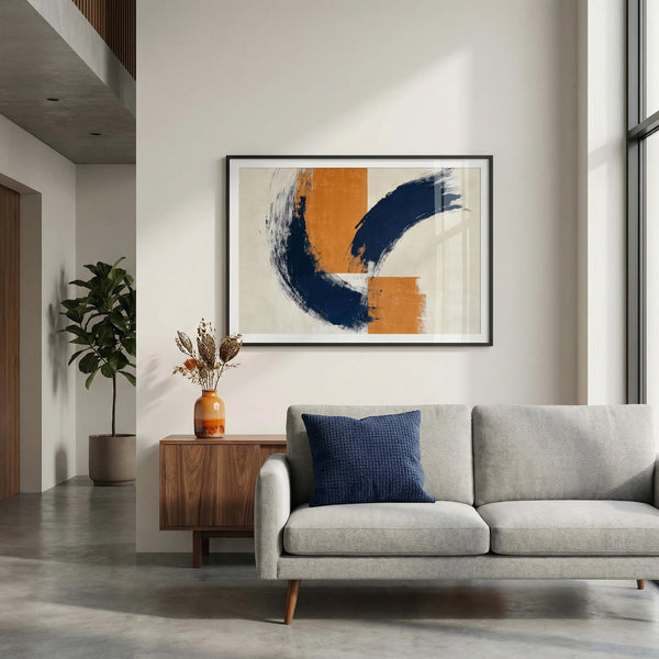 Modern living room with a gray sofa, wooden side table, and abstract art on the wall.