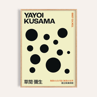 Framed polka dot artwork with black dots on cream background and typographic text