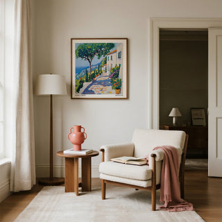 Living room with a chair, side table, and artwork on the wall.