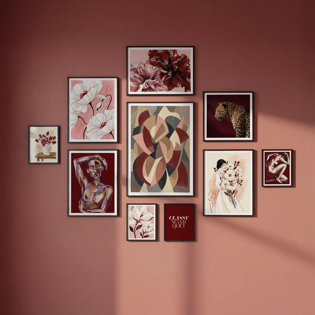 Set of ten art prints showing red, pink and purple abstract designs.