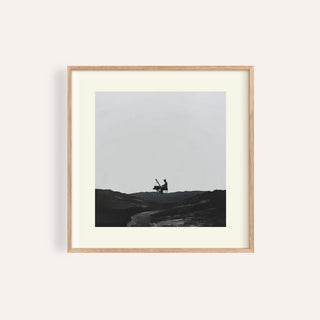 Black-and-white piano abstract art with lone pianist in open field