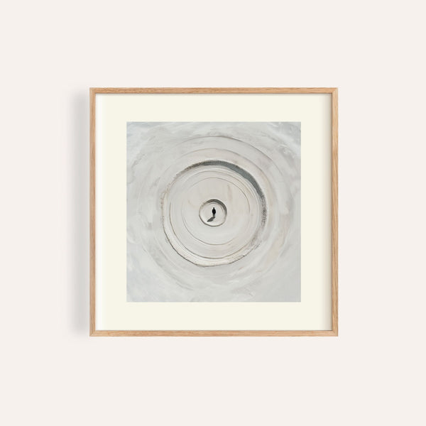 Surrealism posters with solitary figure in concentric sand rings