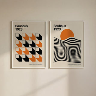 Bauhaus gallery wall art of geometric shapes in orange black and cream on a plain wall