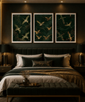Trio of art prints showcasing beautiful cranes against dark green hues above a luxury bed.