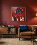 Living room with a brown leather sofa, wooden cabinet, and framed 'Soul & Blues' poster on a red wall.