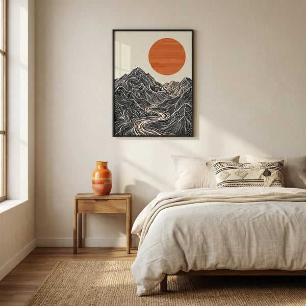Bedroom with a bed, side table, and wall art of mountains and a sun.