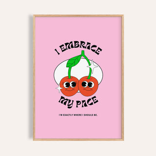 Framed wall art for dorm with a pair of cherries on a pink background