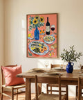 Dining room with a table set for a meal, chairs, and a colorful painting on the wall.