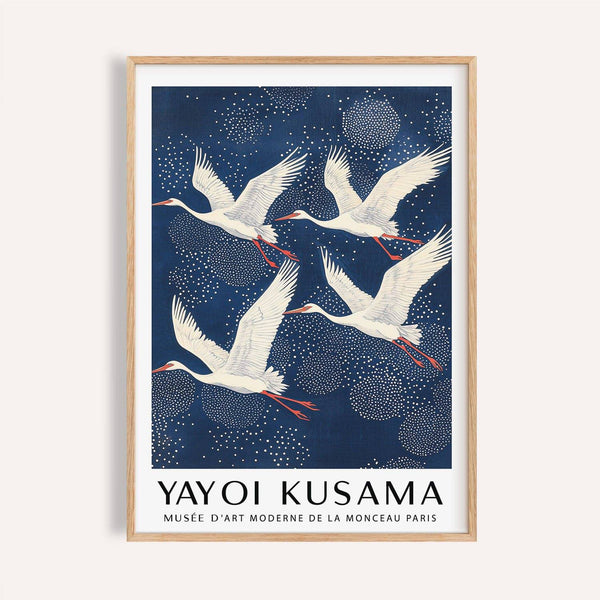 Blue and white prints of cranes flying against a navy sky for minimalist decor.