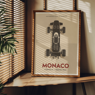Close-up crop of racing poster print focusing on the top-down car body, cockpit details, and wheels