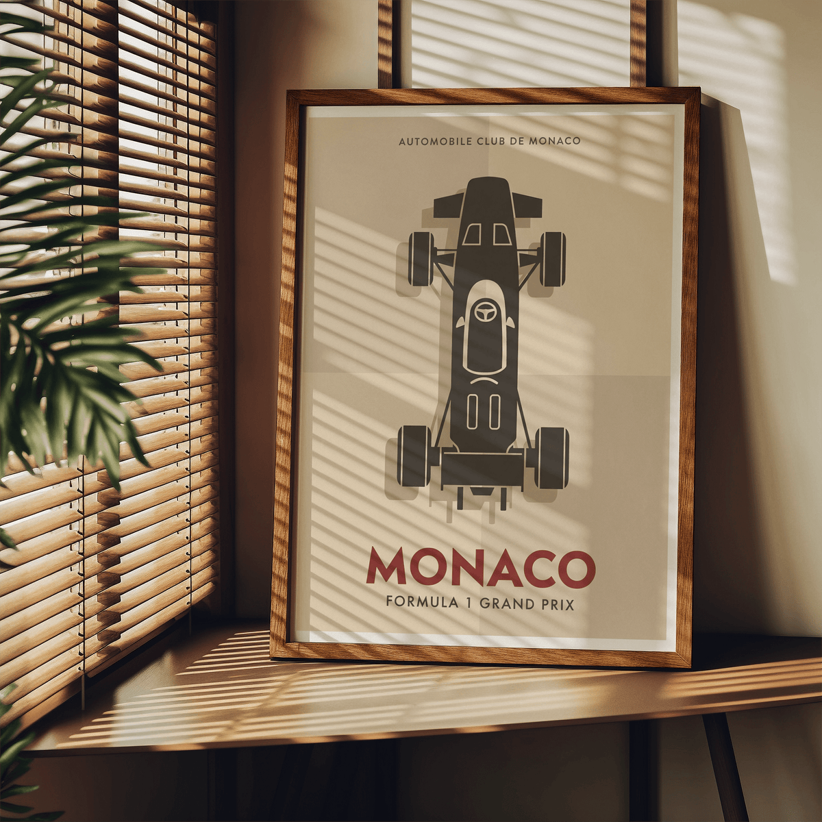 Close-up crop of racing poster print focusing on the top-down car body, cockpit details, and wheels