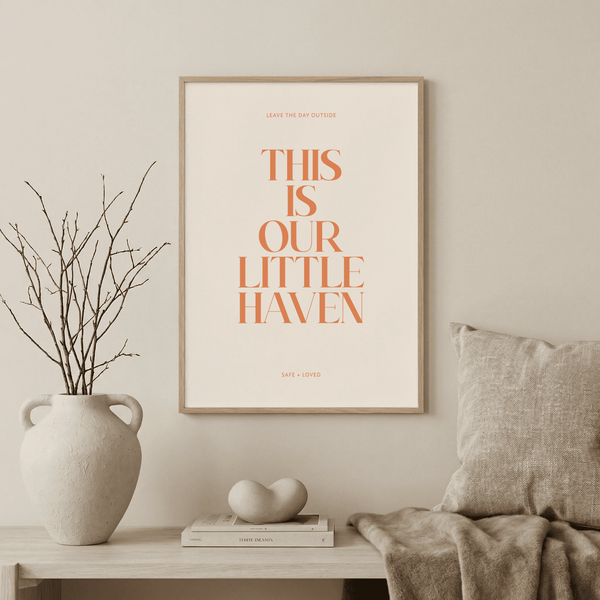 Typography Art Print with “This Is Our Little Haven” quote in orange serif letters on beige background