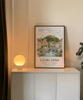 Scenic Slovenia wall art poster of Ljubljana with pastel buildings and clouds