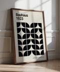 Mid century art prints with black geometric shapes on a neutral background.