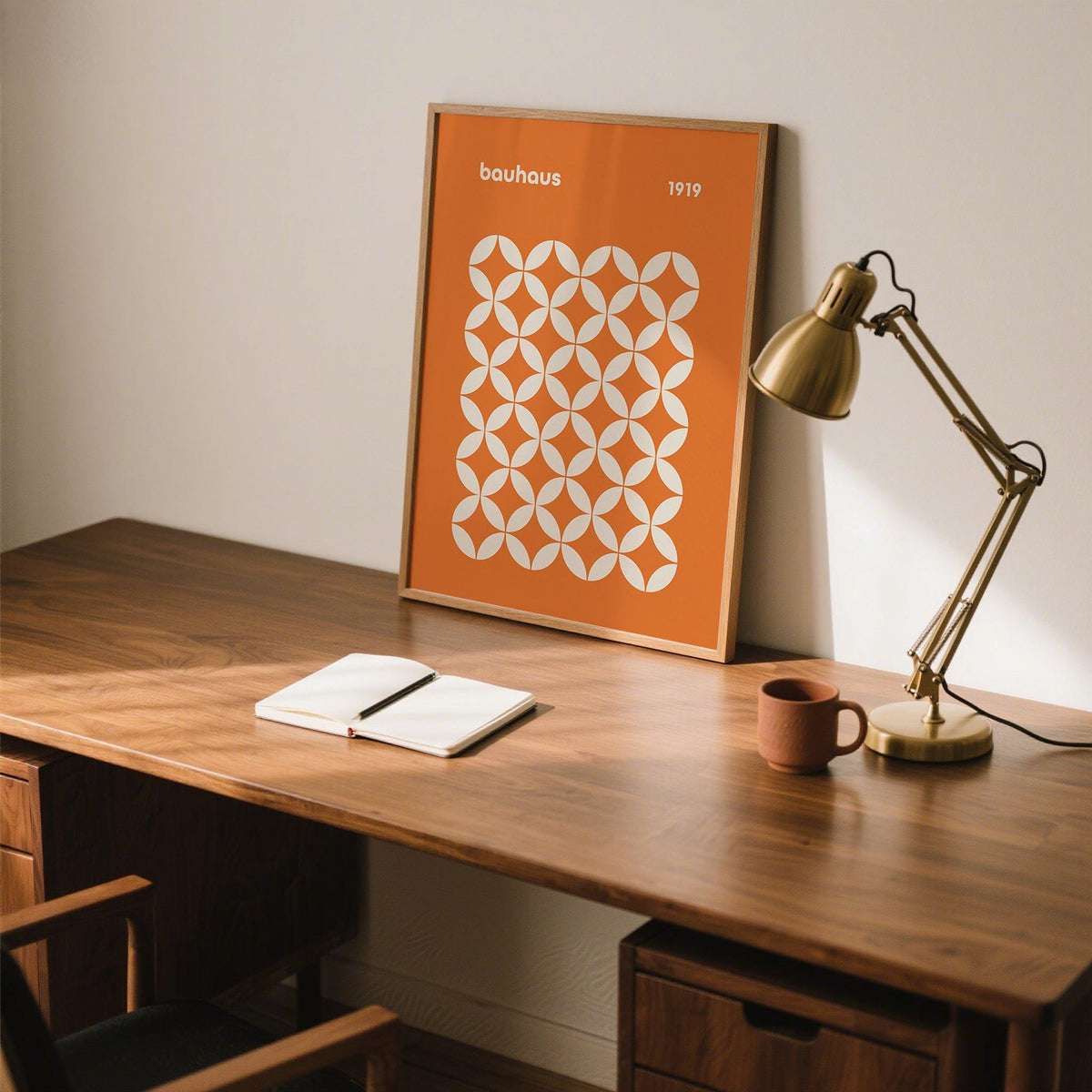 Modern geometric orange poster featuring repeating petal shapes in a square grid.