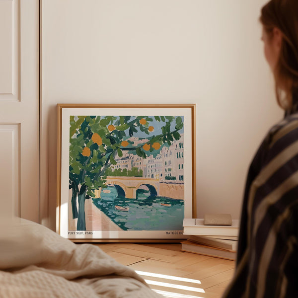 Wall Art of Paris with bright green trees and floating oranges.