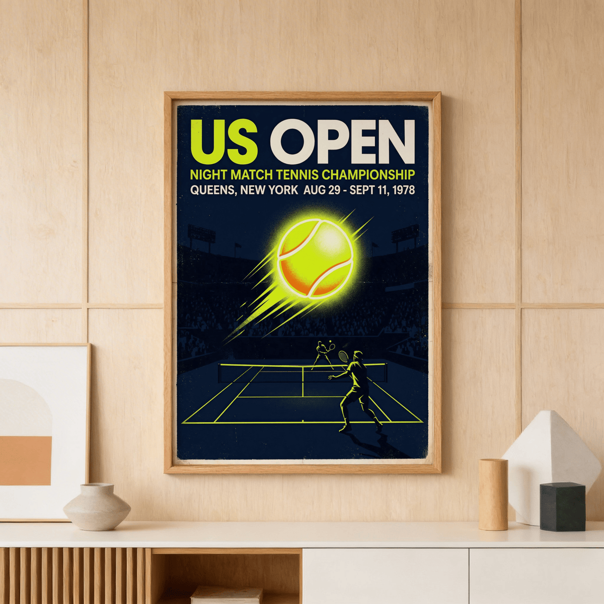 Showcasing a vintage tennis poster print with large event text, stadium crowd silhouette, and bright ball graphic