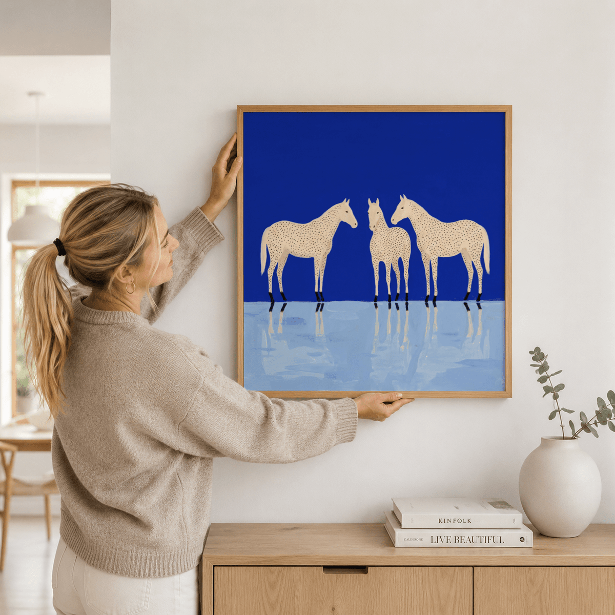 Centered horse print poster with a front-facing figure between two side profiles