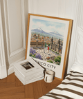 Travel poster wall art featuring Mexico City skyline, plaza market stalls, and large central flag