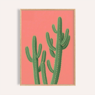 Framed print close-up of pink cactus painting with green saguaro cacti and light wooden frame