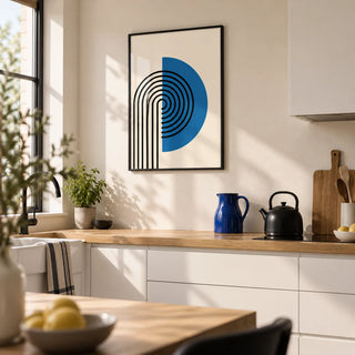 Abstract Arch Print, framed on the wall of a modern kitchen with white cabinets and a cream wall