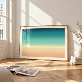 Abstract Beach Wall Art, framed and leaning on the parquet floor of a bright living room
