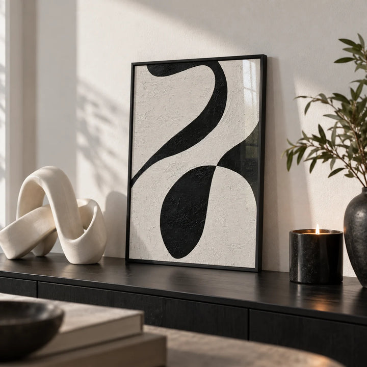 Abstract Black and White Art, a small A4 framed print leaning on a black side table in a hallway