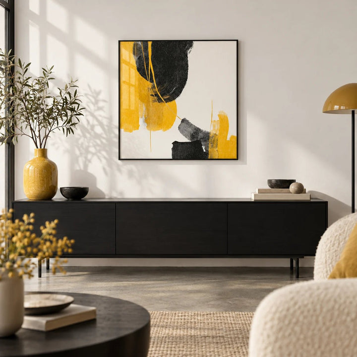 Abstract Black and Yellow Art, framed on the wall of a design-led city-flat living room with a white wall and a polished concrete floor