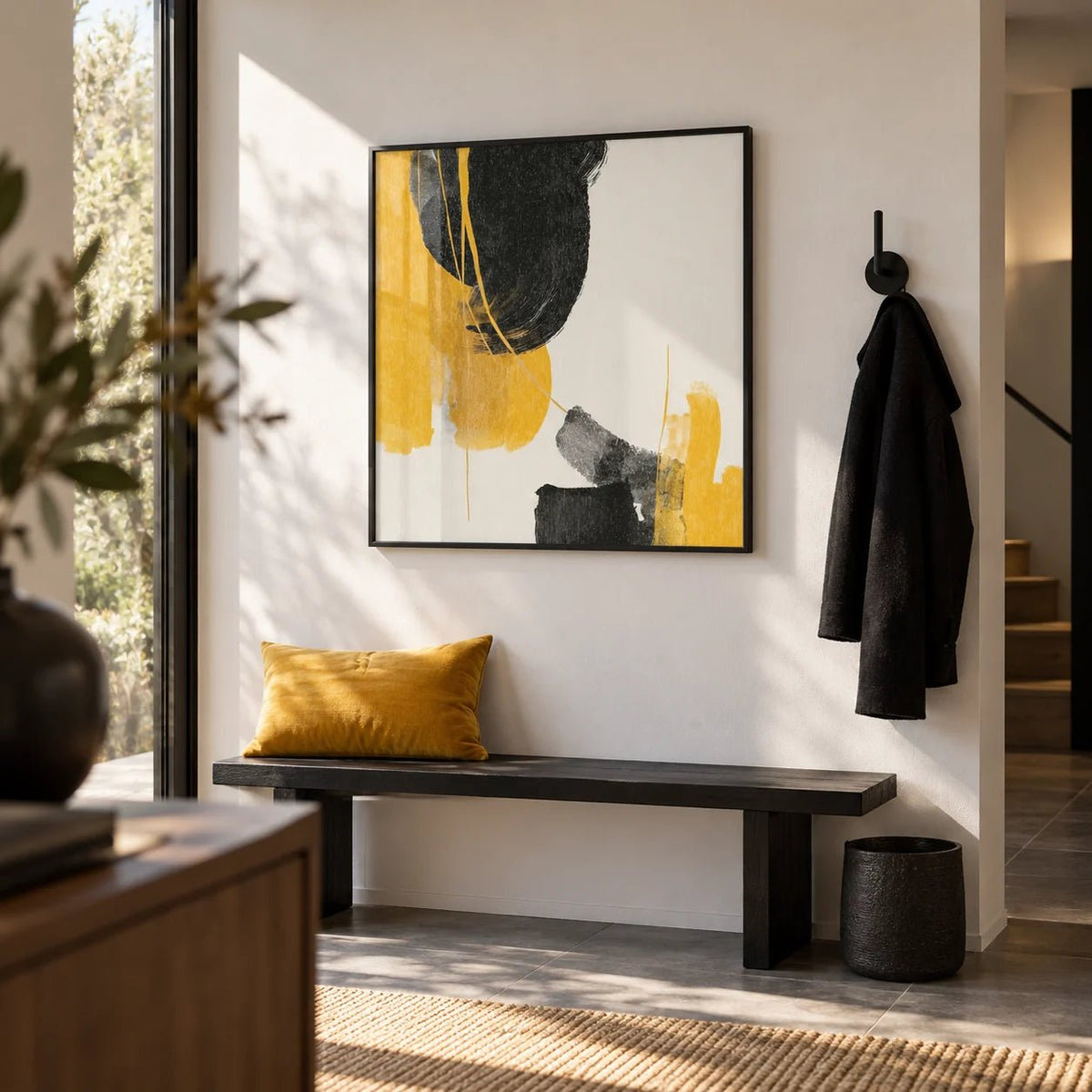Abstract Black and Yellow Art, framed on the wall of a modern hallway with a white wall