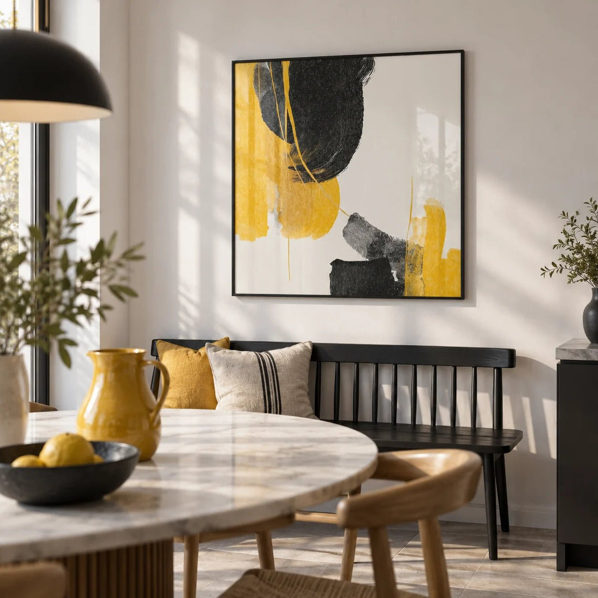Abstract Black and Yellow Art, framed on the wall of a modern kitchen dining area with a white wall