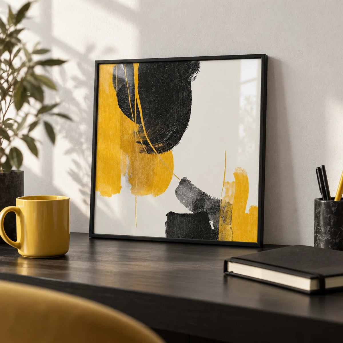Abstract Black and Yellow Art, a small A4 framed print leaning on a black desk
